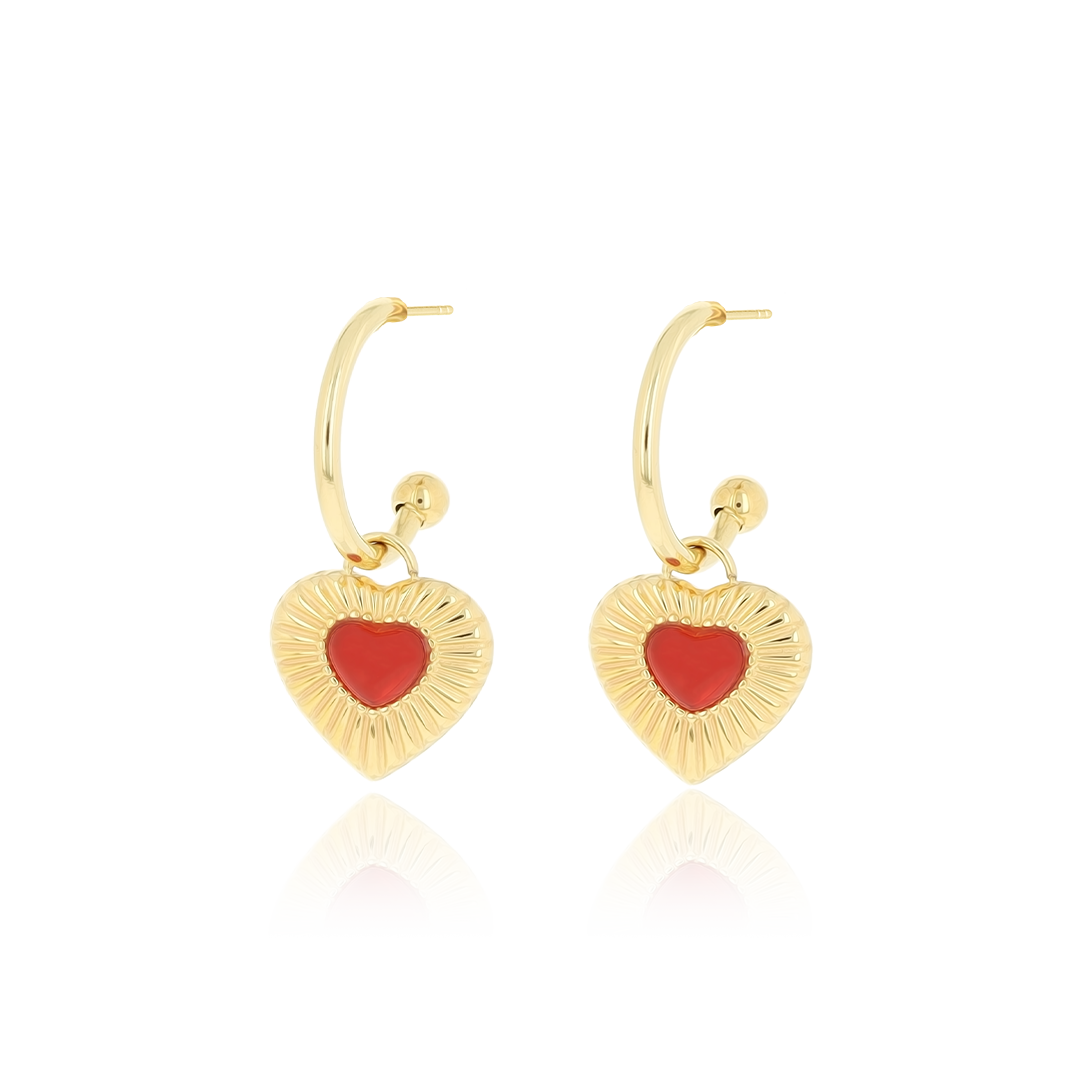 Gold coloured earrings with red heart charm
